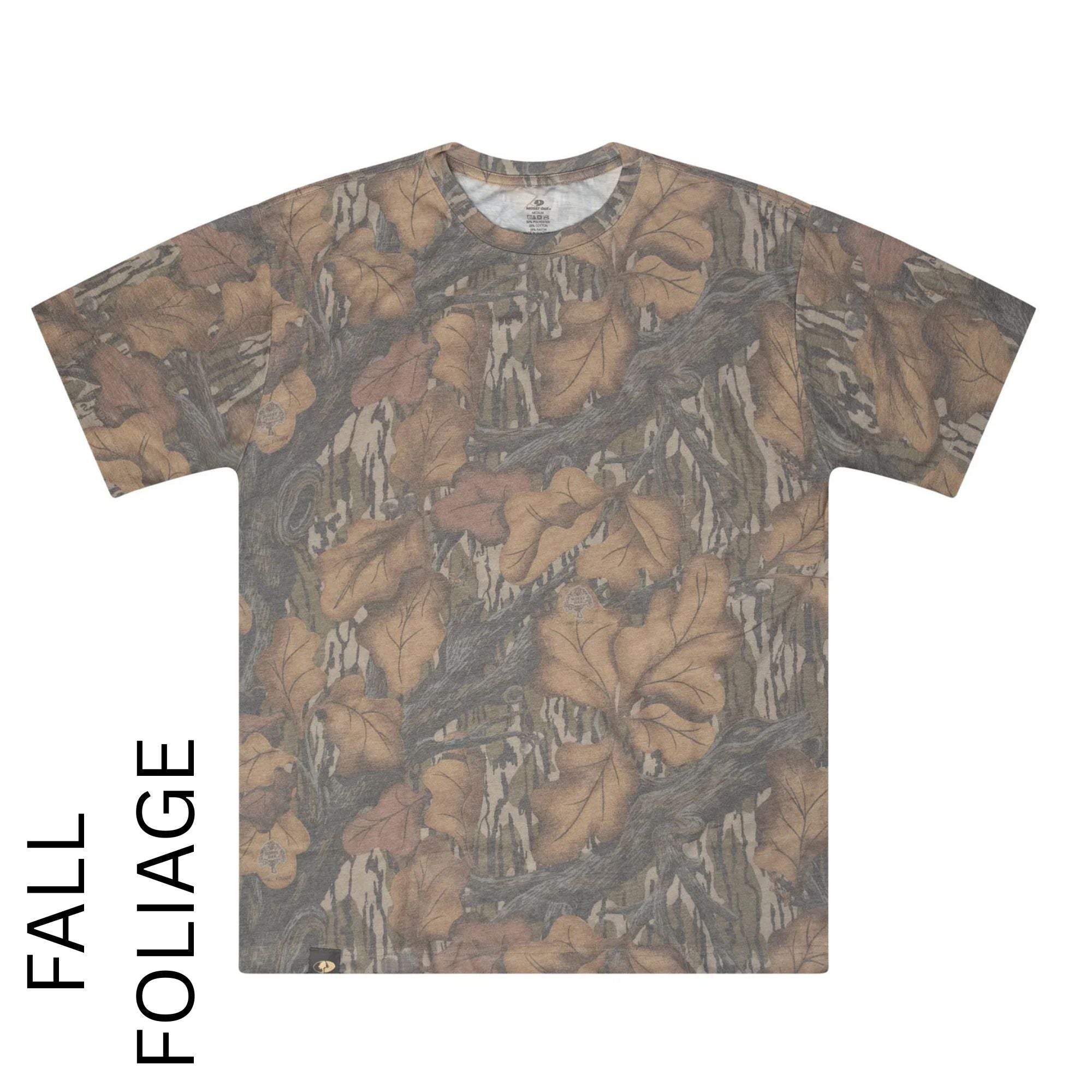 A short-sleeve crewneck t-shirt featuring an all-over autumn foliage camouflage pattern with brown leaves and tree bark on a light gray background. The text 'FALL FOLIAGE' is printed vertically on the left side of the image.