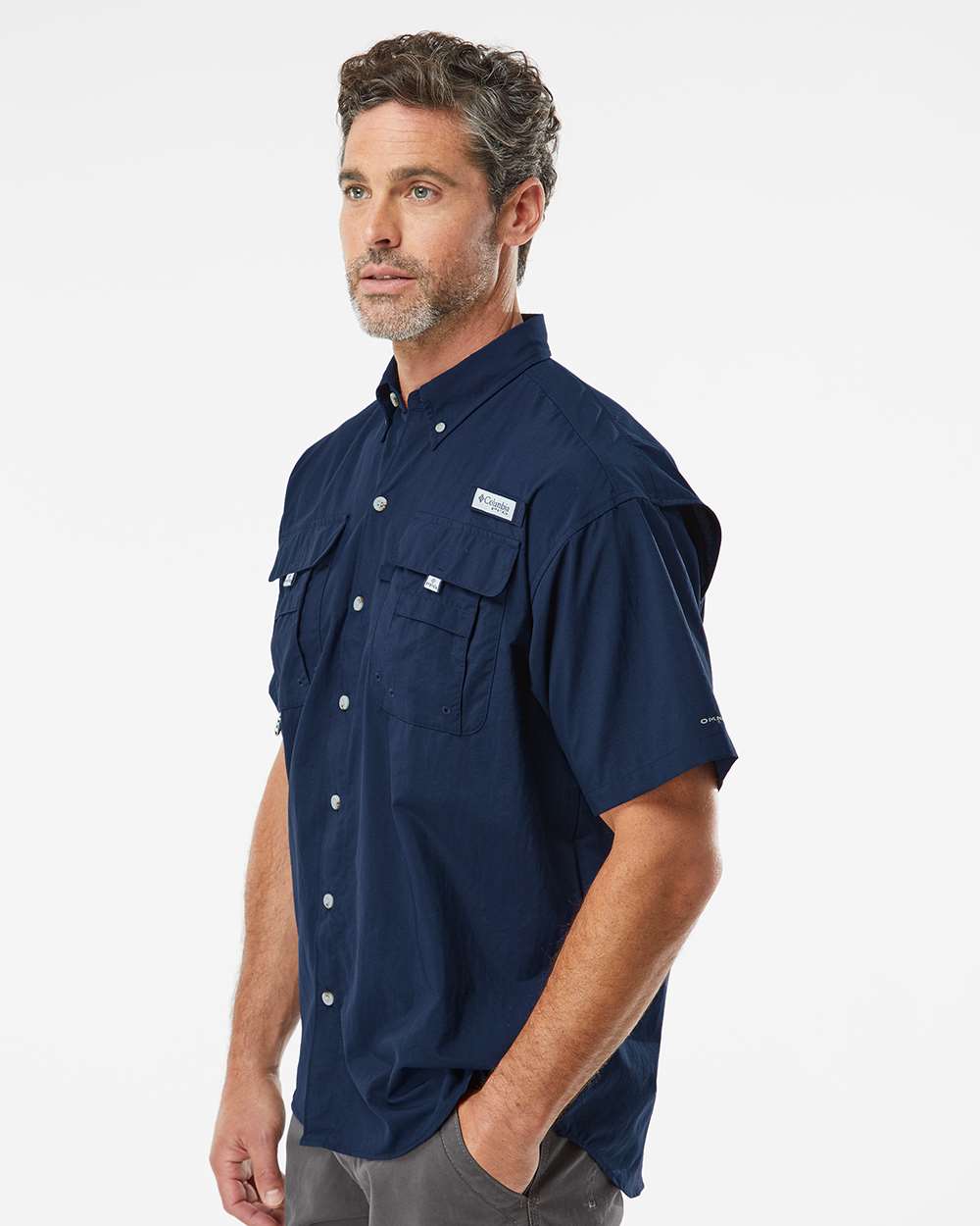 Man wearing a navy blue short-sleeve shirt on a white background